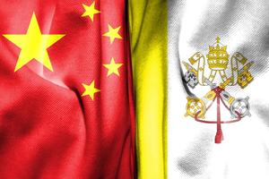 Chinese flag sits next to a Vatican flag. 
