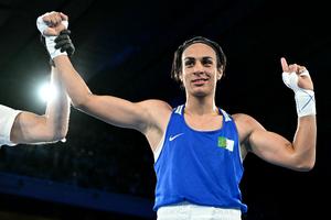 Algeria's Imane Khelif (Blue) reacts after beating Thailand's Janjaem Suwannapheng in the women's 66kg semi-final boxing match during the Paris 2024 Olympic Games at the Roland-Garros Stadium, in Paris on August 6, 2024.
