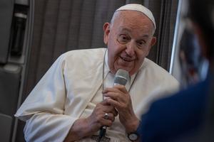 Pope Francis speaks to journalists aboard the papal plane during an in-flight press conference on Friday, Sept. 13, 2024, on his return from his nearly two-week tour of Southeast Asia.
