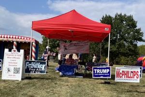 Local Republicans operate a booth at the New Britain Township Veterans Committee Fall Festival and Car Show in Bucks County, Pennsylvania, on Sept. 21, 2024.