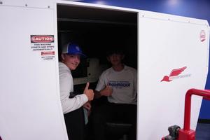 Detroit Catholic Central students give the thumbs-up in the Redbird simulator.
