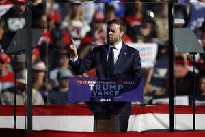 BUTLER, PENNSYLVANIA - OCTOBER 05: Republican vice presidential candidate Sen. JD Vance addresses a campaign rally from behind bullet resistant glass at the Butler Farm Show grounds on October 05, 2024 in Butler, Pennsylvania. This is the first time that Republican presidential nominee, former President Donald Trump has returned to Butler since he was injured during an attempted assassination on July 13.  (Photo by Kevin Dietsch/Getty Images)