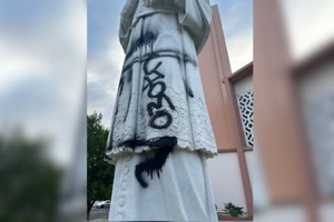 The statue of the patron saint of St. Francis de Sales Parish in Sherman Oaks has been vandalized three times total in September and August. The vandalism in the photograph is being investigated as a “hate crime” by local police, according to the church's pastor.