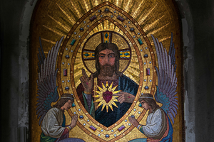 Mosaic tile composition of the Sacred Heart of Jesus and angels inside a Paris cemetery chapel
