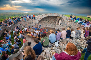 University of Mary students gather to celebrate the Blessed Mother’s birthday at the school’s grotto.