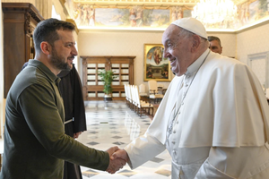 Ukraine President Volodymyr Zelenskyy shakes hands with Pope Francis during a meeting at the Vatican on Oct. 11.
