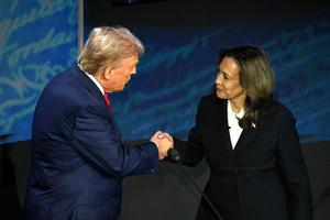 Vice President and Democratic presidential candidate Kamala Harris (R) shakes hands with former US President and Republican presidential candidate Donald Trump during a presidential debate at the National Constitution Center in Philadelphia, Pennsylvania, on September 10, 2024. 