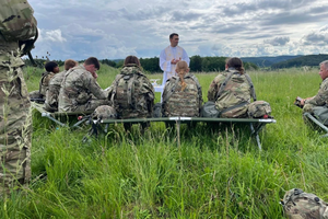 Father Adam Muda, a chaplain for the U.S. Army, celebrates Mass on the field with soldiers while in Germany.