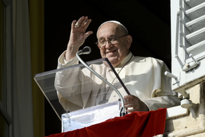 Pope Francis waves to pilgrims gathered in St. Peter's Square for his Angelus address on Nov. 10, 2024.