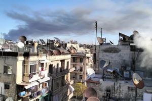 Smoke of war rises over a residential area in Aleppo. On Dec. 1, 2024, the Franciscan complex of the Terra Santa College in Aleppo was hit by a strike. No casualties were reported.