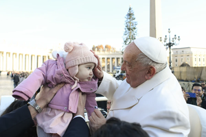 Pope Francis blesses a toddler during his general audience on Wednesday, Dec. 4, 2024, in St. Peter’s Square.