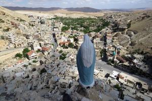 A general view shows a statue of the Virgin Mary overlooking the ancient Christian town of Maalula, 56 kilometers northeast of the Syrian capital Damascus.  Islamist-led rebels declared that they have taken Damascus in a lightning offensive on December 8, 2024. 