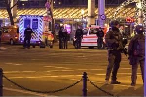Police and ambulances stand next to a Christmas market where a car crashed into a crowd injuring between 60 and 80 people, according to a spokesman for the local rescue service, on Dec. 20, 2024, in Magdeburg, eastern Germany. 