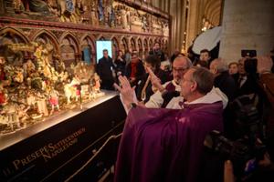 Msgr. Olivier Ribadeau Dumas, archpriest of Notre-Dame de Paris Cathedral, blesses a Nativity scene in the recently reopened cathedral on Dec. 20, 2024, in Paris. 