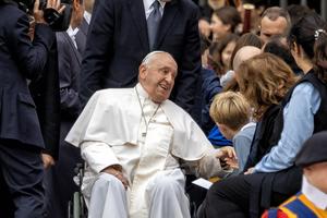 Pope Francis speaks with a child Oct. 16 after the Wednesday audience in St. Peter’s Square.