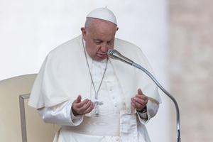 Pope Francis prays during his Wednesday general audience in St. Peter’s Square at the Vatican on Oct. 9, 2024.
