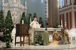 From left to right: Auxiliary Bishop of the Our Lady of the Angels Pastoral Region Matthew G. Elshoff, St. Monica pastor Father Lloyd Torgerson, and Corpus Christi pastor Monsignor Liam Kidney celebrate Mass at St. Monica Church with Corpus Christi’s surviving tabernacle next to the altar on Jan. 12, 2025.