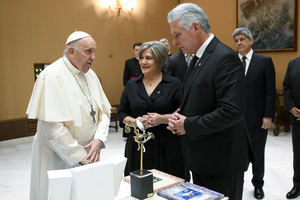 Cuban President Miguel Díaz-Canel and his wife, Lis Cuesta Pedraza, present gifts to Pope Francis during their meeting on Tuesday, June 20, 2023, at the Vatican.