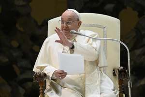 Pope Francis waves to the crowd in the Paul VI Audience Hall at the Vatican during his Wednesday general audience on Jan. 22, 2025.