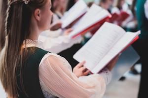 Choir sings in a cathedral. 