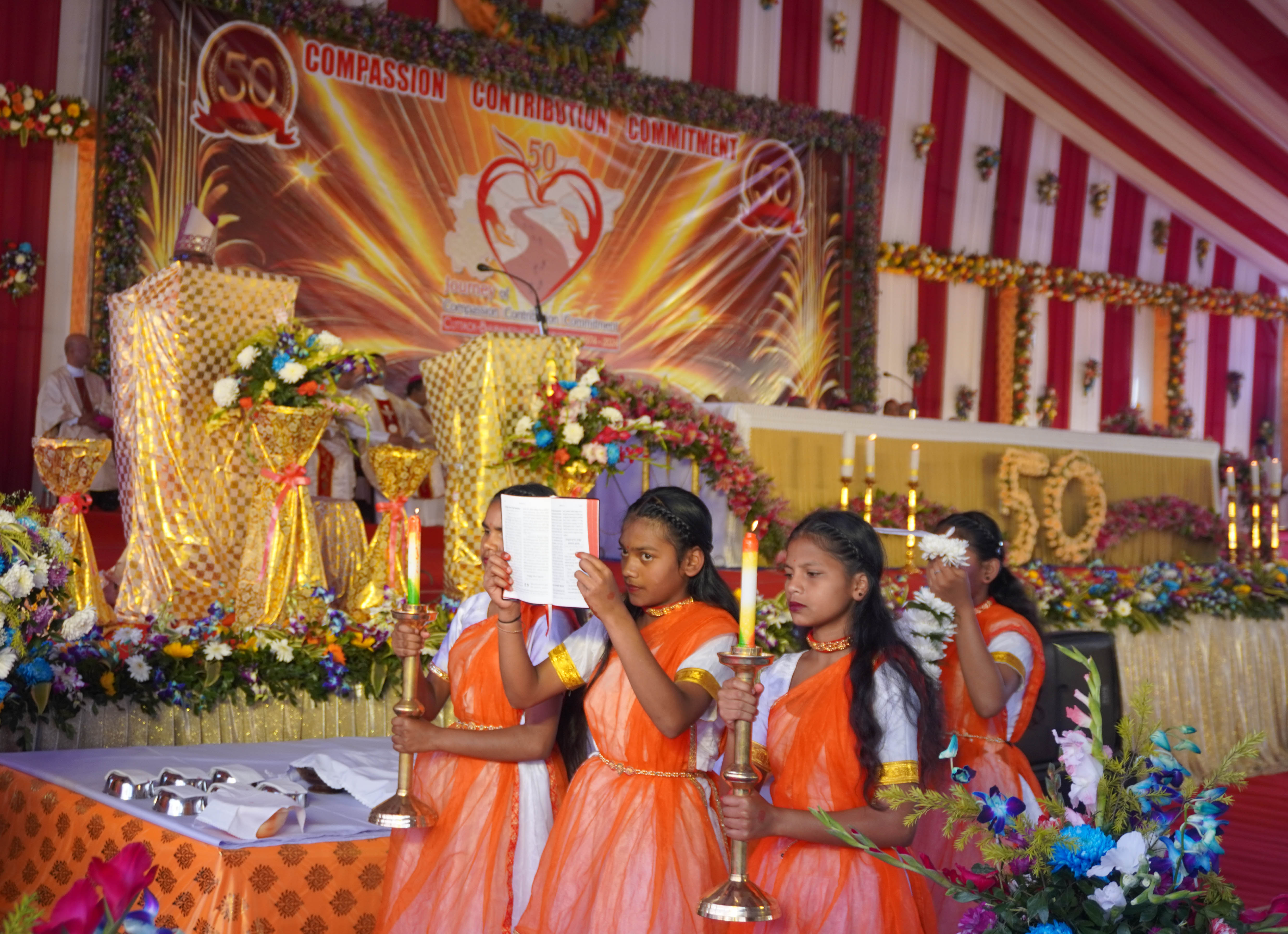 Bible being broght for readding during golden jubilee Mass