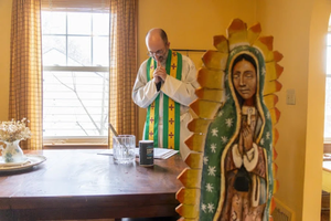 Father Jonathan St. André, TOR, blesses the dining room of Guadalupe House, a maternity home for pregnant students designed to provide a faith-filled environment to support student moms as they continue their education at Franciscan University of Steubenville.