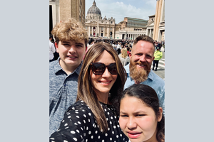 The MacIver family smiles in Rome, with St. Peter’s Basilica in background on Easter 2025.