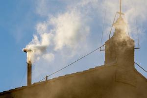 Smoke billows out from the chimney atop Sistine Chapel announcing news of the new pope on May 8, 2025.