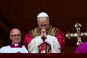 Newly elected Pope Leo XIV, born Robert Prevost in Chicago, addresses the crowd from the main central loggia balcony of St. Peter’s Basilica for the first time, on May 8, 2025.