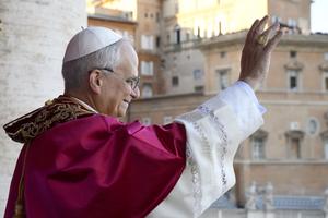 Pope Leo XIV waves to the faithful in his first papal appearance on May 8, 2025.