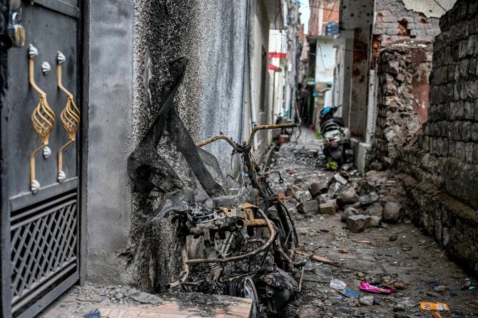 A burnt scooter on May 9, 2025, stands on the spot where twins Zian Khan and Urwa Fatima died on May 7 during Pakistani artillery shelling in the main town of Poonch district. 