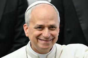 Pope Leo XIV reacts during an audience with the media, at Paul VI Hall, in the Vatican, on May 12, 2025. 