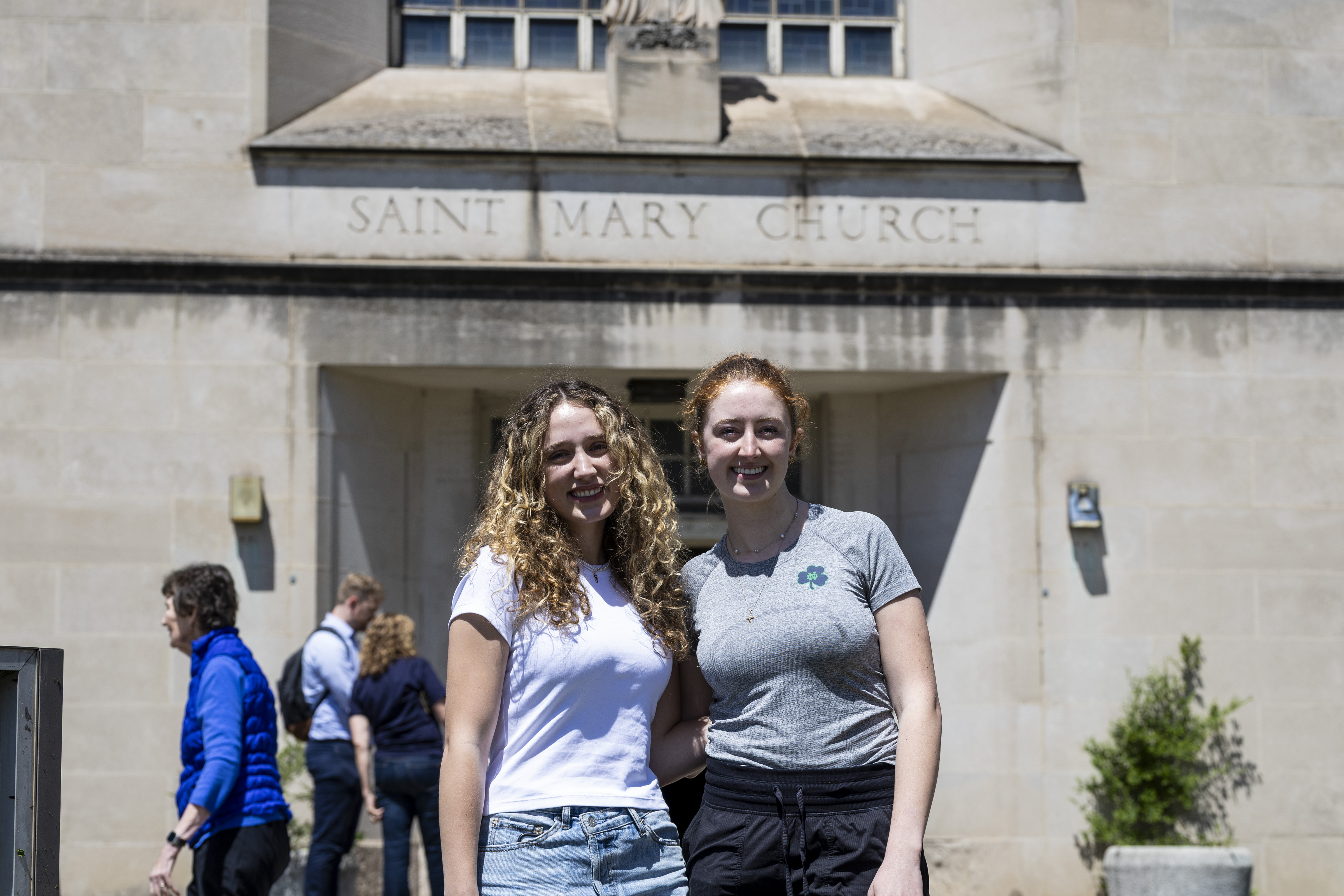 Francesca Lichtenberger, left, and Bridget Healy, are sophomores at the University of Notre Dame and were traveling home after the semester and decided to stop and see Pope Leo XIV’s childhood church and school, St. Mary’s in Chicago, on Friday May 9, 2025.