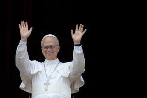 Pope Leo XIV waves at a massive, jubilant crowd gathered on St. Peter’ s Square for the Regina Coeli on Sunday, May 11, 2025.