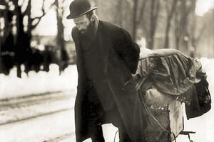 A rag picker — once a common sight in cities across North America and Europe — pulls his cart loaded with rags and other salvaged materials down Bloor Street West in Toronto, Ontario, Canada, circa 1911.