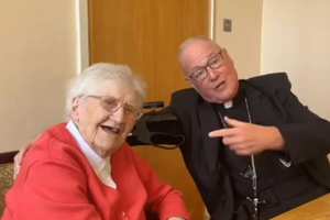 Cardinal Timothy Dolan, archbishop of New York, with Sister Mary Bosco of the Sisters of Mercy, a 100-year-old Irish nun who taught him to “love and serve the Lord.”