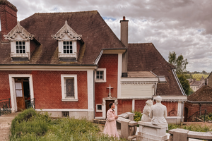 Claire Couche is photographed in the garden of the childhood home of St. Thérèse, Les Buissonnets, in Lisieux, France.