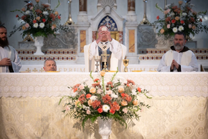Archbishop Charles C. Thompson elevates the Eucharist during the Opening Mass at St. John the Evangelist Church in Indianapolis, marking the official launch of the St. Katharine Drexel Route. May 18, 2025.