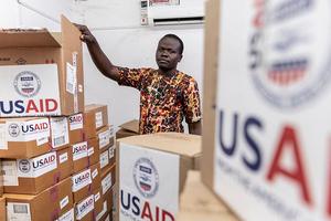 Pharmacist Joseph Njer Airo inspects boxes of antiretroviral drugs labeled "USAID," from the last donation before the funding cuts inside the medical stockroom of Migosi Sub-county Hospital on April 24, 2025 in Kisumu, Kenya. Kisumu has one of the highest HIV rates in Kenya, with around 17.6% of the adult population are living with the virus, nearly five times the national average of 4.5%. In 2025, Kisumu has become a focal point of a growing healthcare crisis, as funding cuts from the United States Agency for International Development (USAID) ripple through the local health system. 