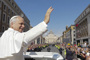 From the popemobile, Pope Leo XIV greets thousands of people lined up along Via della Conciliazione on the morning of his inaugural Mass, Sunday, May 18, 2025.