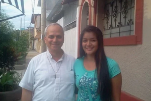 Mildred Camacho, the Peruvian goddaughter of Pope Leo XIV, with then-Father Robert Prevost.