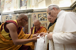 Pope Leo XIV greets Buddhist monks in a meeting with representatives of other Christian churches, ecclessial communities, and other religions on May 19, 2025, at the Vatican.