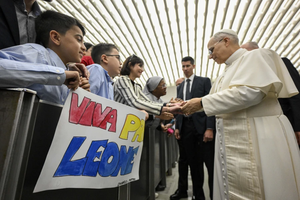 Pope Leo XIV meets employees of the Holy See and their families in the Paul VI Hall at the Vatican on Saturday, May 24, 2025.