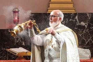 Catholicos-Patriarch of the Assyrian Catholic Church of the East Mar Awa III censes during Christmas Eve service at the Cathedral of the Holy Apostles, within the complex of the Assyrian Catholic Patriarchate of the East, in the capital of Iraq's northern autonomous Kurdish region Arbil on December 24, 2024. 