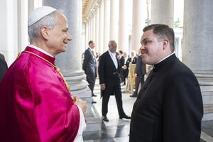 Deacon Kieran Burt greets Pope Leo XIV outside the Basilica of St. Paul Outside the Walls May 20, 2025.