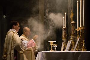 A priest celebrates a Traditional Latin Mass censing the altar in the church of St Pancratius located in Rome. 
