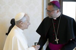 Pope Leo XIV greets Lithuanian Archbishop Visvaldas Kulbokas June 6 at the Vatican.