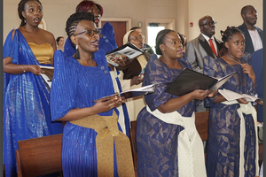 Bridget Nadunga Gidudu, second from the left, sings with other members of the Uganda Catholic Community of Michigan at Christ the King in Ann Arbor in 2024.
