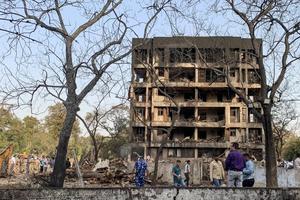 A general view shows a damaged building at the site where Air India flight 171 crashed in a residential area near the airport in Ahmedabad on June 12, 2025. | Credit: SAM PANTHAKY/AFP via Getty Images