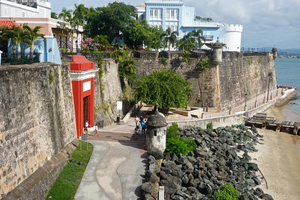 Scene of the walled city of Old San Juan, Puerto Rico. The oldest governor’s mansion under the American flag, La Fortaleza, is top right.